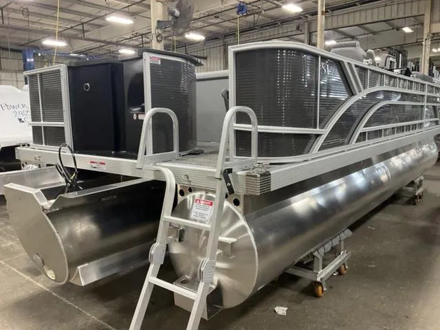 Slide: The Image of 2024 Bennington 22 SVS pontoon boat in a warehouse. - 9