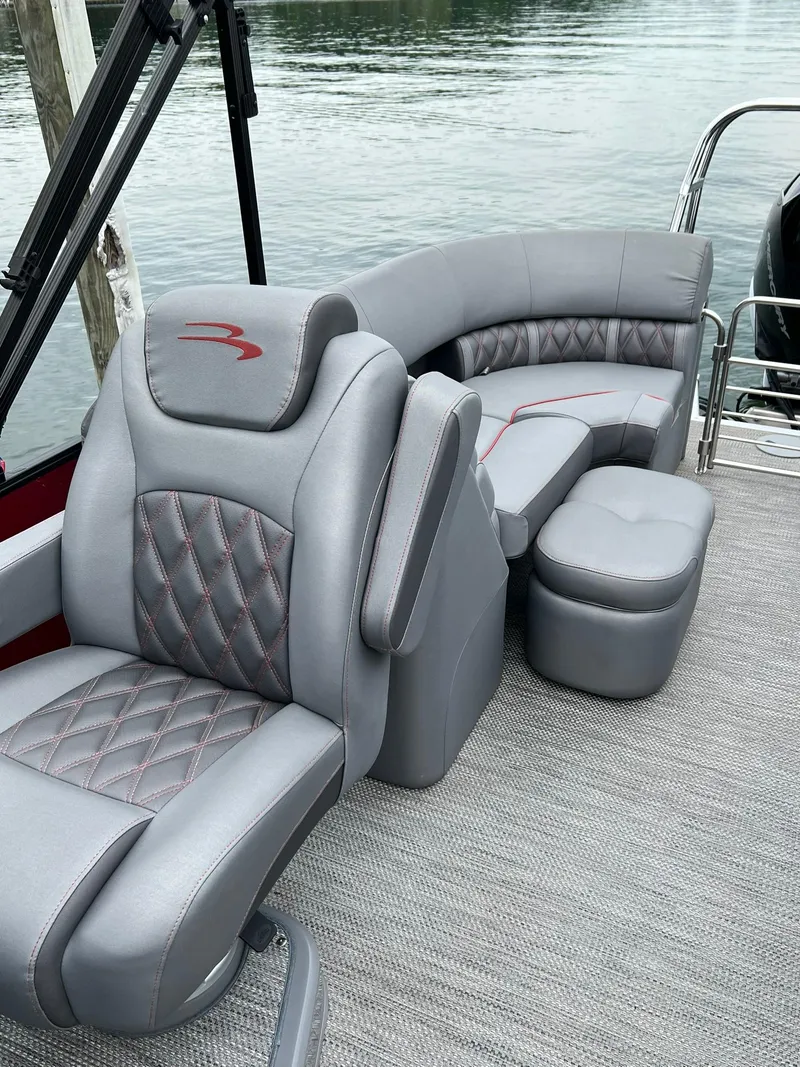 Slide: The Image of 2022 Bennington 24 LXFB boat with luxurious gray seating and diamond-stitched upholstery. - 15