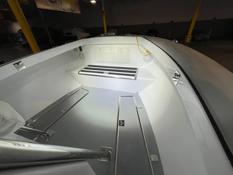 Slide: The Image of Interior of a 2017 Custom Carolina Style boat, featuring sleek design and storage compartments. - 48