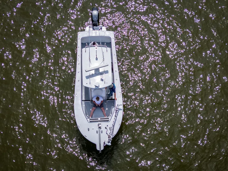 Slide: The Image of Aerial view of 2017 Custom Carolina Style boat on shimmering water. - 7