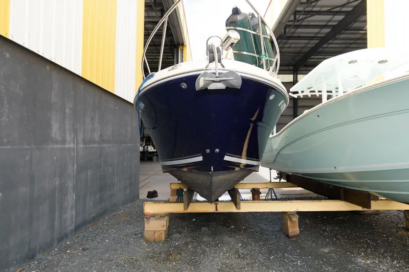 Slide: The Image of 2005 Sea Ray 260 Sundancer boat in dry dock storage. - 2