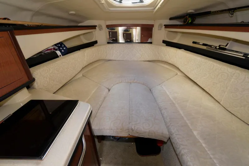 Slide: The Image of Interior cabin of a 2005 Sea Ray 260 Sundancer boat with beige upholstery. - 7