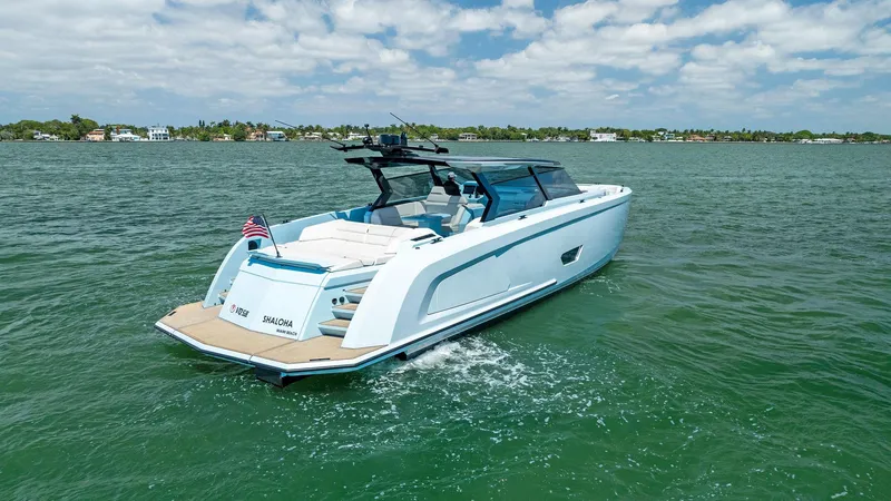 Slide: The Image of 2022 Vanquish Yachts VQ58 luxury yacht cruising on a sunny day. - 10