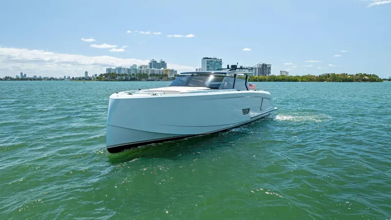 Slide: The Image of 2022 Vanquish Yachts VQ58 cruising on a sunny day. - 12