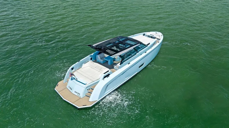 Slide: The Image of 2022 Vanquish Yachts VQ58 luxury yacht cruising on open water. - 13