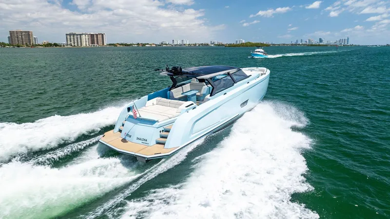 Slide: The Image of Vanquish Yachts VQ58 2022 cruising on open water under a clear sky. - 19