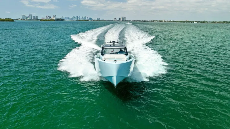 Slide: The Image of 2022 Vanquish Yachts VQ58 cruising on open water. - 21