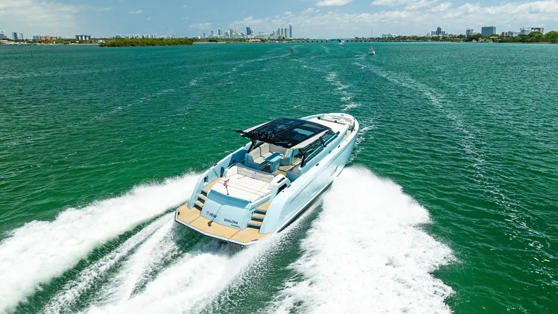 Slide: The Image of 2022 Vanquish Yachts VQ58 cruising on open water, rear view. - 22