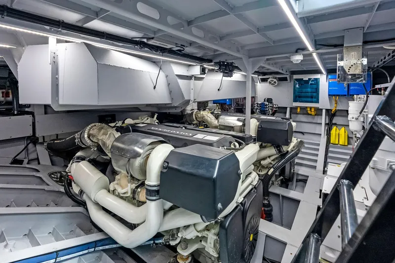Slide: The Image of Engine room of 2022 Vanquish Yachts VQ58 with modern equipment and lighting. - 27