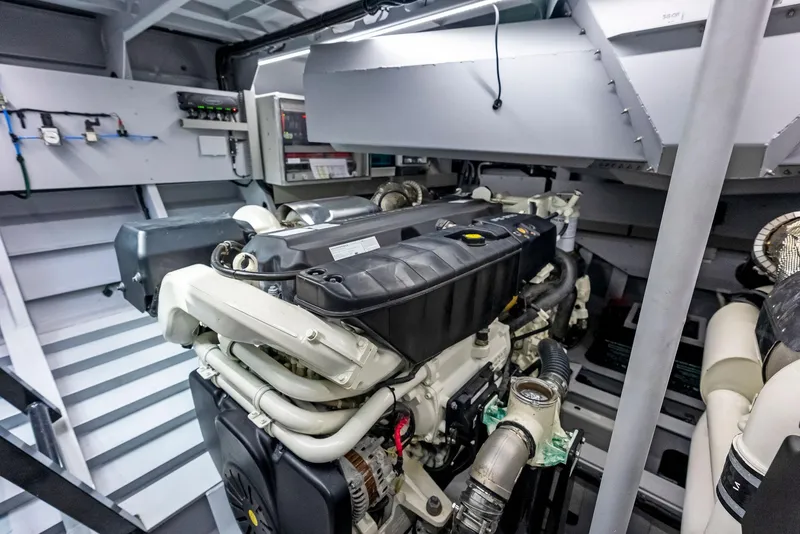Slide: The Image of Engine room of 2022 Vanquish Yachts VQ58, showcasing advanced marine engine. - 29