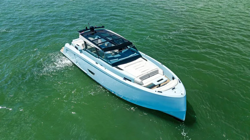 Slide: The Image of 2022 Vanquish Yachts VQ58 luxury yacht cruising on open water. - 3