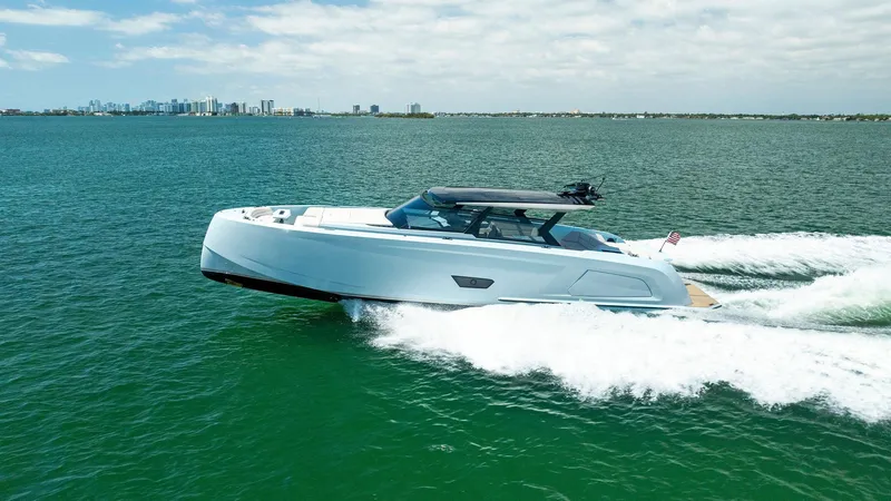 Slide: The Image of 2022 Vanquish Yachts VQ58 cruising on open water. - 4