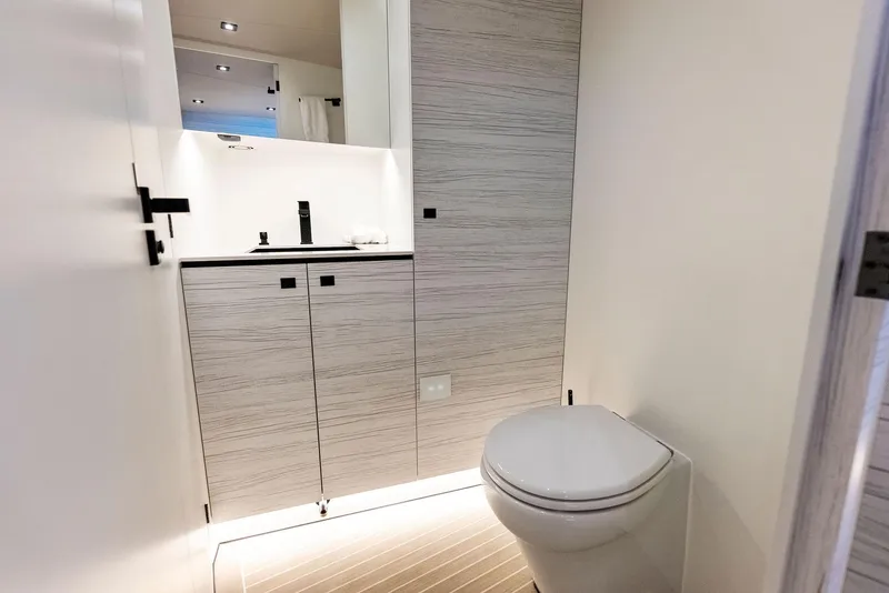 Slide: The Image of Modern bathroom interior on the 2022 Vanquish Yachts VQ58, featuring sleek design and high-end fixtures. - 41