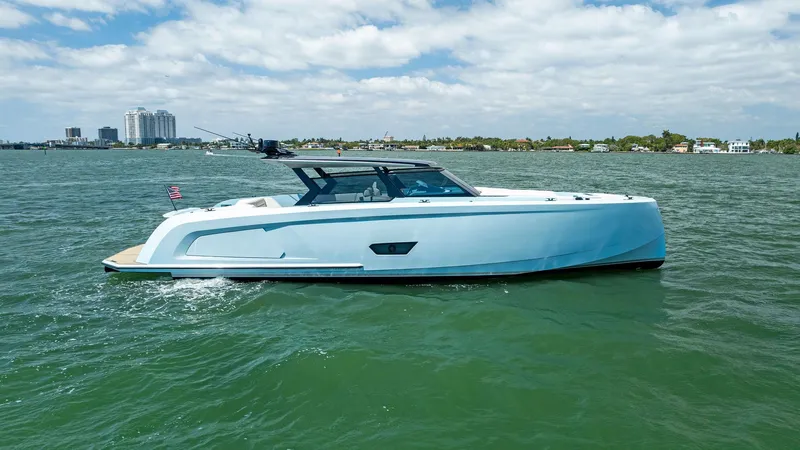 Slide: The Image of 2022 Vanquish Yachts VQ58 cruising on a sunny day in coastal waters. - 5