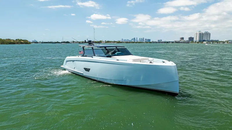 Slide: The Image of 2022 Vanquish Yachts VQ58 cruising on a sunny day in open water. - 6