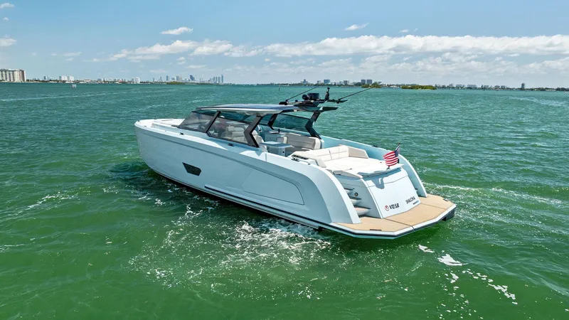 Slide: The Image of 2022 Vanquish Yachts VQ58 luxury yacht cruising on open water. - 8