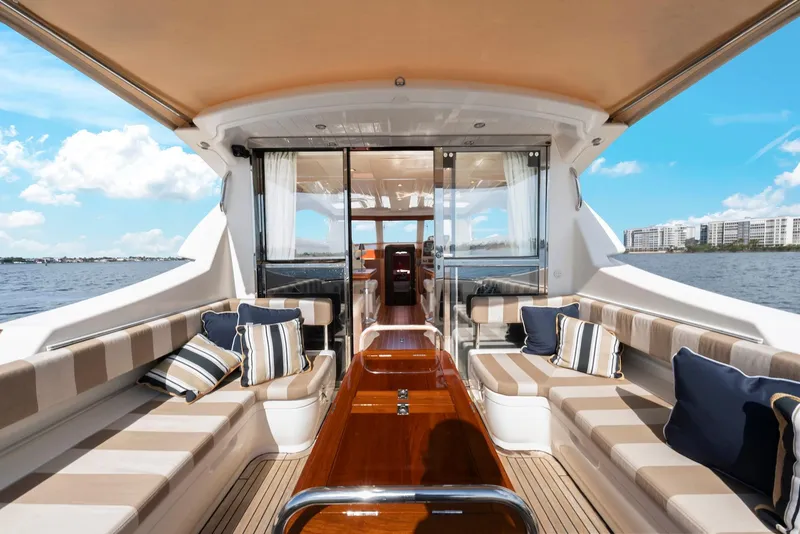 Slide: The Image of Luxurious 2007 Oyster LD43 yacht interior with elegant seating and scenic ocean view. - 21