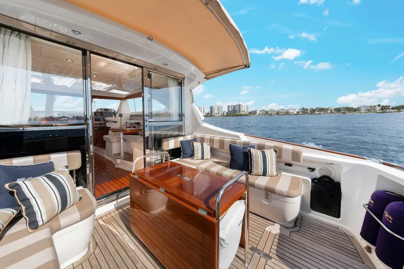 Slide: The Image of Luxurious 2007 Oyster LD43 yacht interior with elegant seating and scenic ocean view. - 22