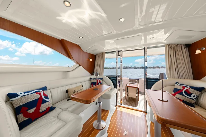 Slide: The Image of Luxurious interior of 2007 Oyster LD43 yacht with nautical-themed decor and scenic water view. - 31