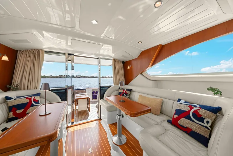 Slide: The Image of Luxurious interior of a 2007 Oyster LD43 yacht with elegant seating and wooden accents. - 32