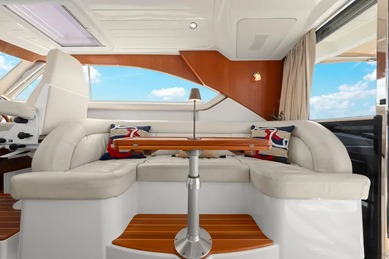 Slide: The Image of Luxurious interior of 2007 Oyster LD43 yacht with plush seating and elegant wooden table. - 33