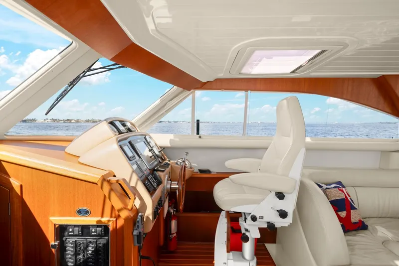 Slide: The Image of Interior of 2007 Oyster LD43 yacht with helm station and luxurious seating. - 35