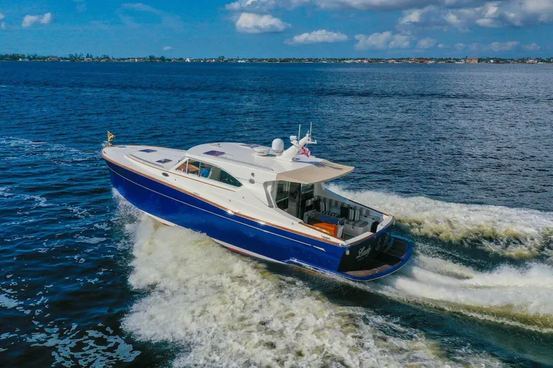 Slide: The Image of 2007 Oyster LD43 yacht cruising on open water under a clear blue sky. - 4