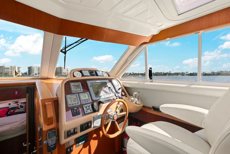 Slide: The Image of Interior of 2007 Oyster LD43 yacht with modern navigation equipment and luxurious seating. - 42