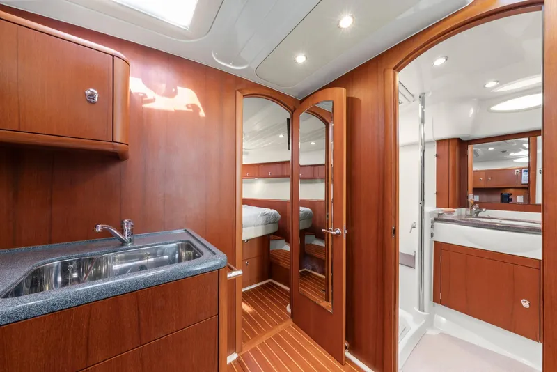 Slide: The Image of Interior of 2007 Oyster LD43 yacht with wooden cabinetry and modern fixtures. - 48