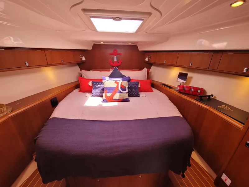 Slide: The Image of Luxurious 2007 Oyster LD43 yacht cabin with cozy bed and nautical decor. - 54