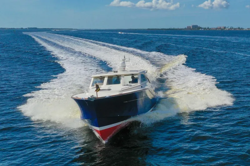 Slide: The Image of 2007 Oyster LD43 yacht cruising swiftly on open blue water. - 7