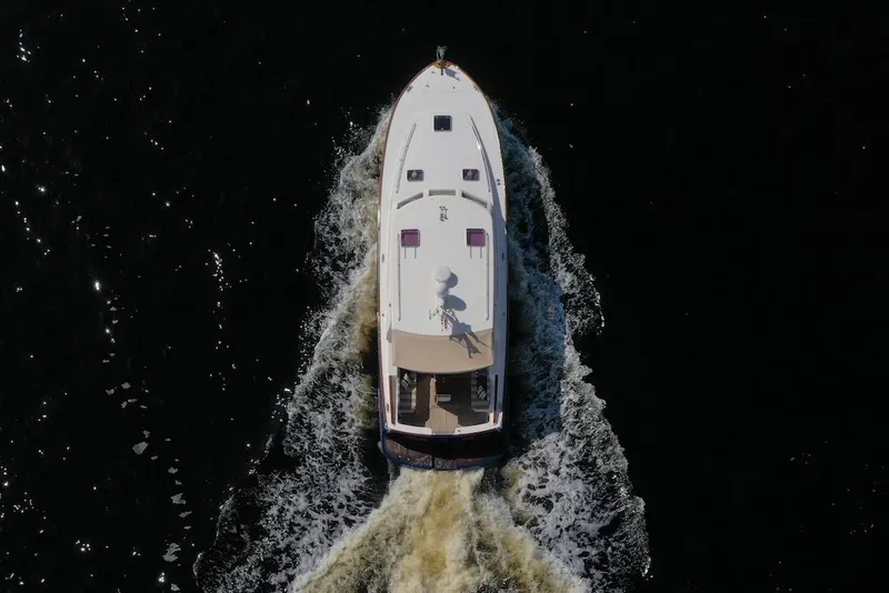 Slide: The Image of Aerial view of 2007 Oyster LD43 yacht cruising on dark water. - 8