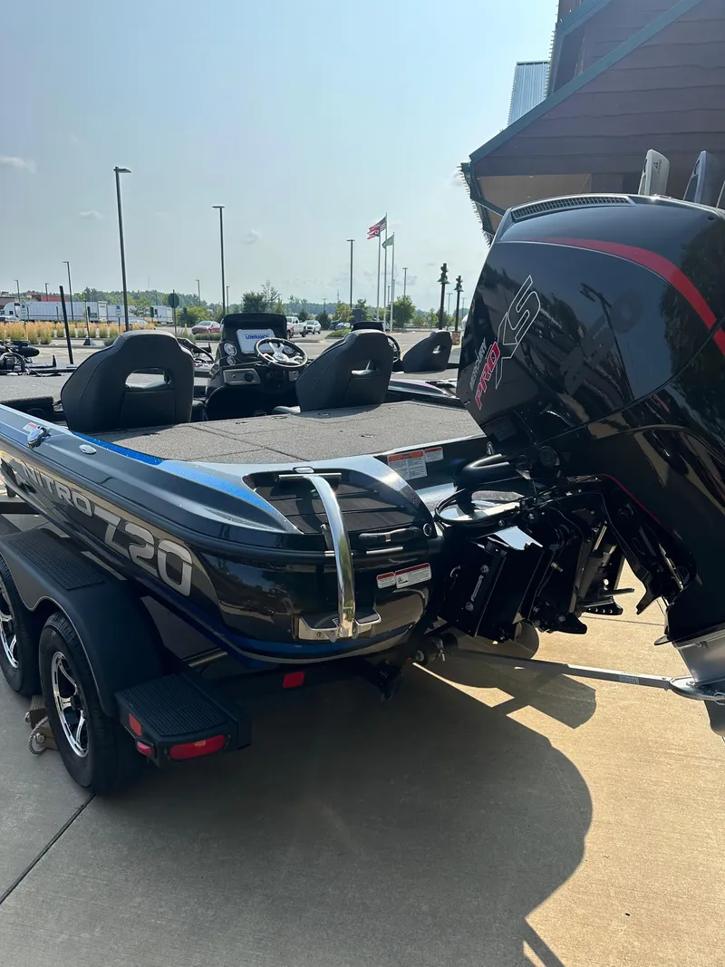 Slide: The Image of 2024 Nitro Z20 Pro fishing boat with powerful outboard motor. - 2