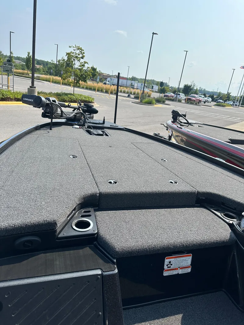 Slide: The Image of 2024 Nitro Z20 Pro fishing boat deck in a parking lot. - 4