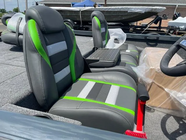 Slide: The Image of 2024 Ranger RT188P boat interior with green and gray seats. - 3