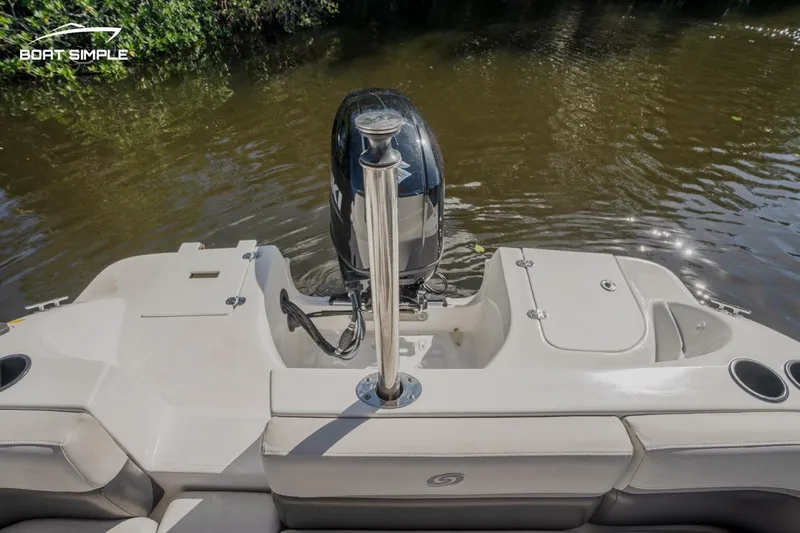 Slide: The Image of 2022 Hurricane 217 SD boat stern with outboard motor on calm water. - 12
