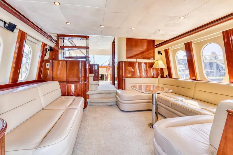 Slide: The Image of Luxurious interior of a 2001 Viking Sport Cruisers Motoryacht with elegant seating and wood finishes. - 10