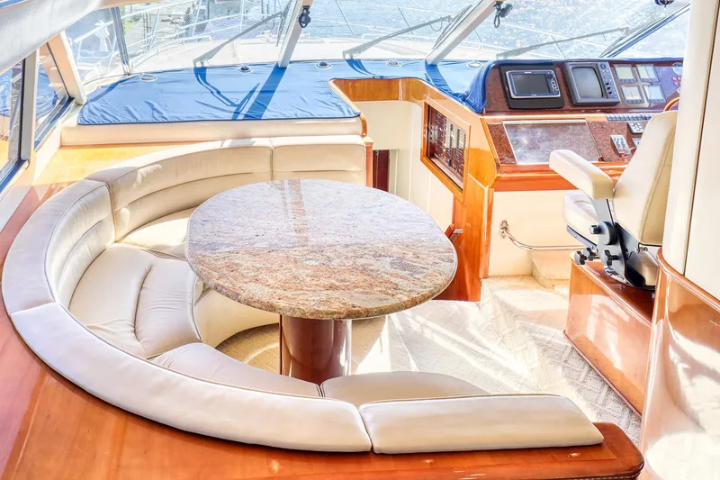 Slide: The Image of Luxurious 2001 Viking Sport Cruisers Motoryacht interior with plush seating and elegant helm station. - 15