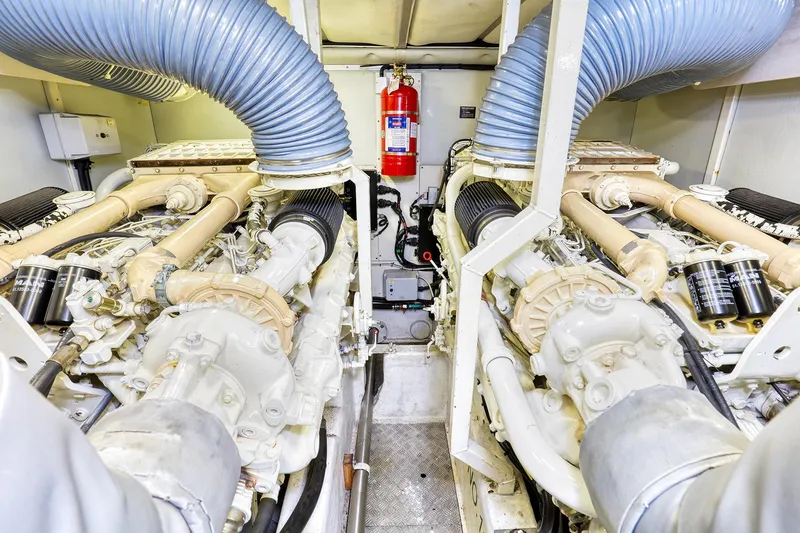 Slide: The Image of Engine room of 2001 Viking Sport Cruisers Motoryacht with dual engines and fire extinguisher. - 28