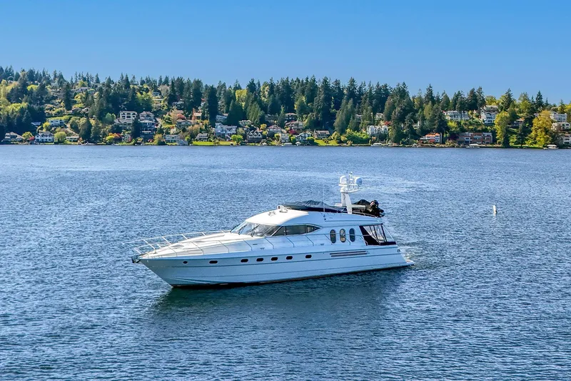 Slide: The Image of 2001 Viking Sport Cruisers Motoryacht on scenic lake with forested shoreline. - 7