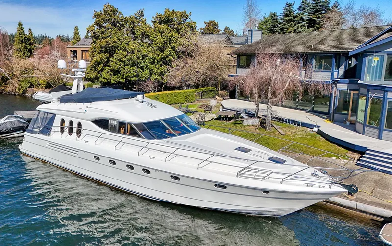 Slide: The Image of 2001 Viking Sport Cruisers Motoryacht docked by waterfront homes. - 8