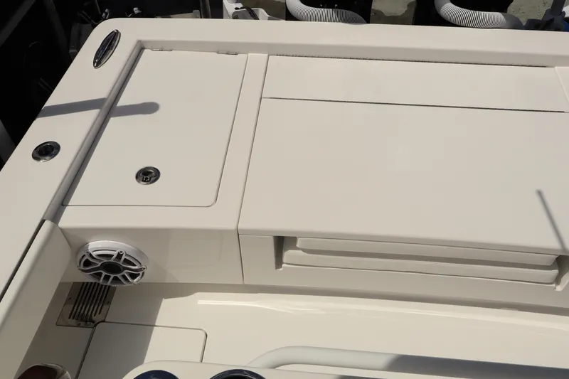 Slide: The Image of 2024 Valhalla Boatworks V-28 deck with storage compartments and speaker. - 14