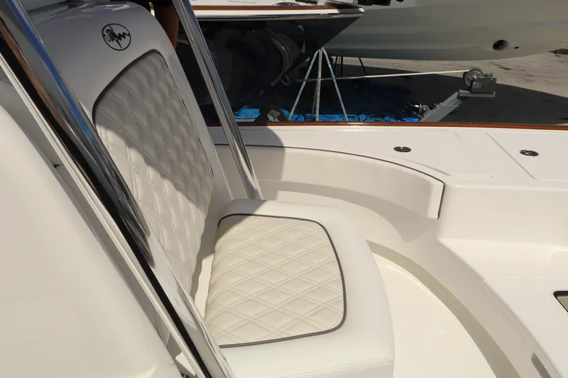 Slide: The Image of 2024 Valhalla Boatworks V-28 interior seating with diamond-stitched upholstery. - 16