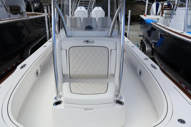 Slide: The Image of 2024 Valhalla Boatworks V-28 center console seating area with white upholstery. - 17