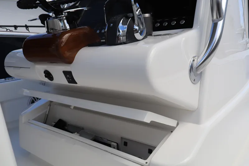 Slide: The Image of 2024 Valhalla Boatworks V-28 helm station with storage compartment. - 19