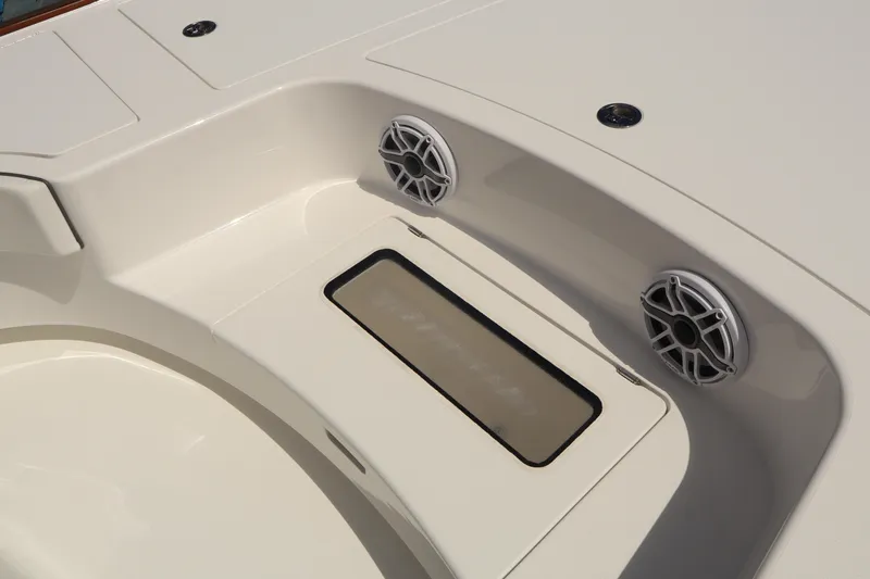 Slide: The Image of 2024 Valhalla Boatworks V-28 interior with speakers and storage compartment. - 28