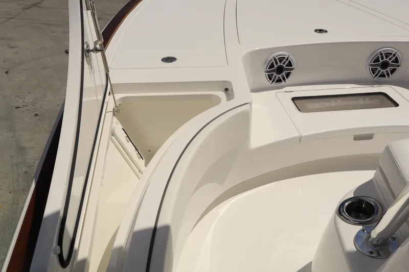 Slide: The Image of 2024 Valhalla Boatworks V-28 interior, featuring storage compartments and speaker system. - 29