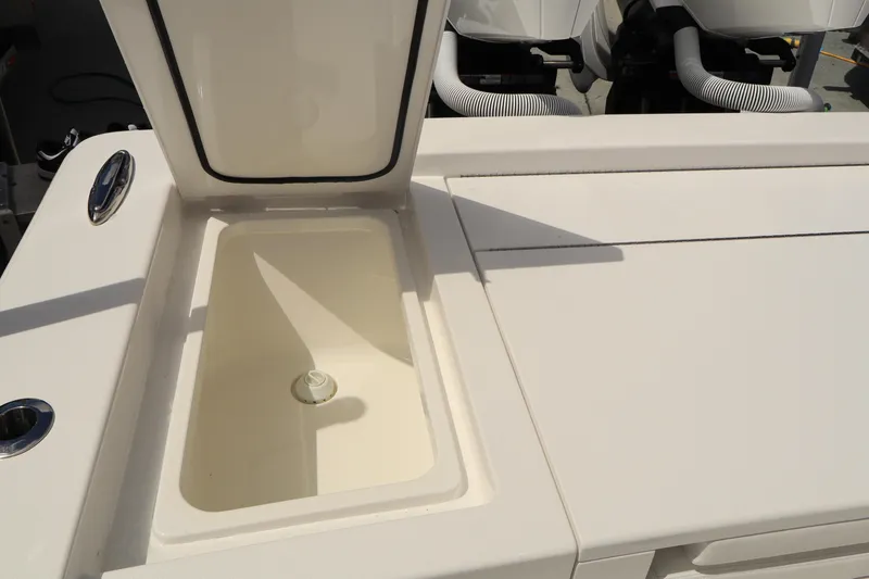 Slide: The Image of 2024 Valhalla Boatworks V-28 open storage compartment on deck. - 33