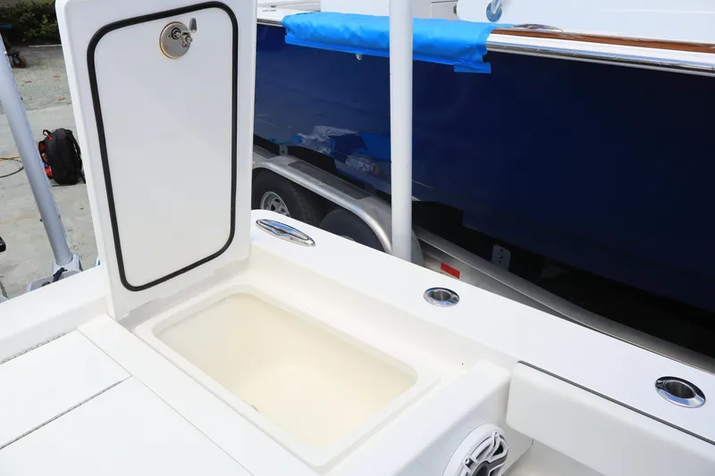 Slide: The Image of 2024 Valhalla Boatworks V-28 open storage compartment on deck. - 34