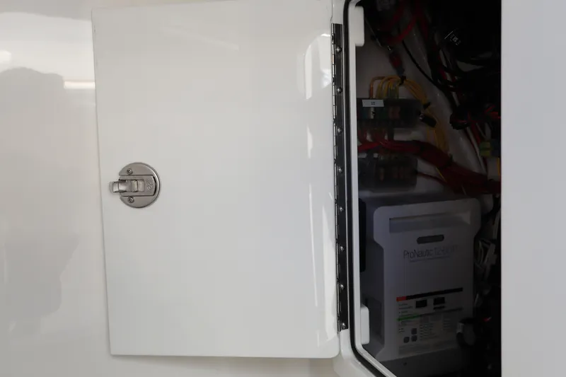 Slide: The Image of Electrical compartment of 2024 Valhalla Boatworks V-28 with open access panel. - 38
